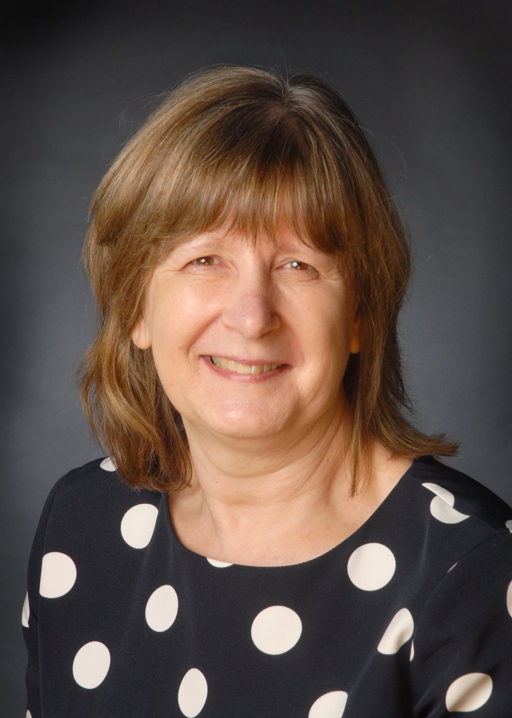 A photograph of Alison Broom, Chief Executive