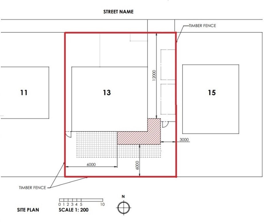 An example of an acceptable proposed site plan. The plan is focused on a building labelled 13. The timber fence surrounding it is outlined in red. Hard surfaces are identified with a black grid and a red hashed area. The scale bar at the bottom of the image is 1:200 and the north compass is next to it.