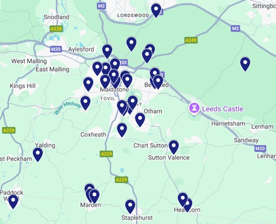 Map of Maidstone area in Kent, UK, showing blue icons for locations of music groups. Includes towns like Bearsted, Marden, and Headcorn, with major roads and Leeds Castle marked.